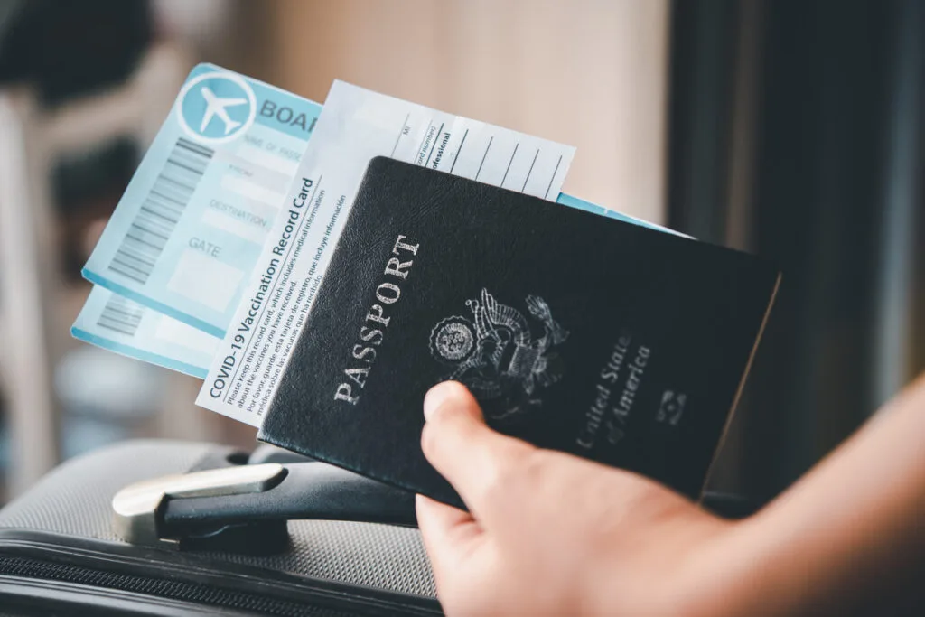 people-holding-passports-and-air ticket